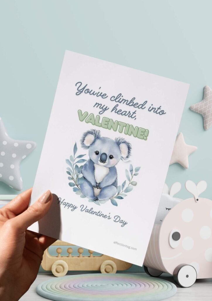 A cute watercolor koala surrounded by eucalyptus leaves with the text "You've climbed into my heart, Valentine! Happy Valentine's Day."
